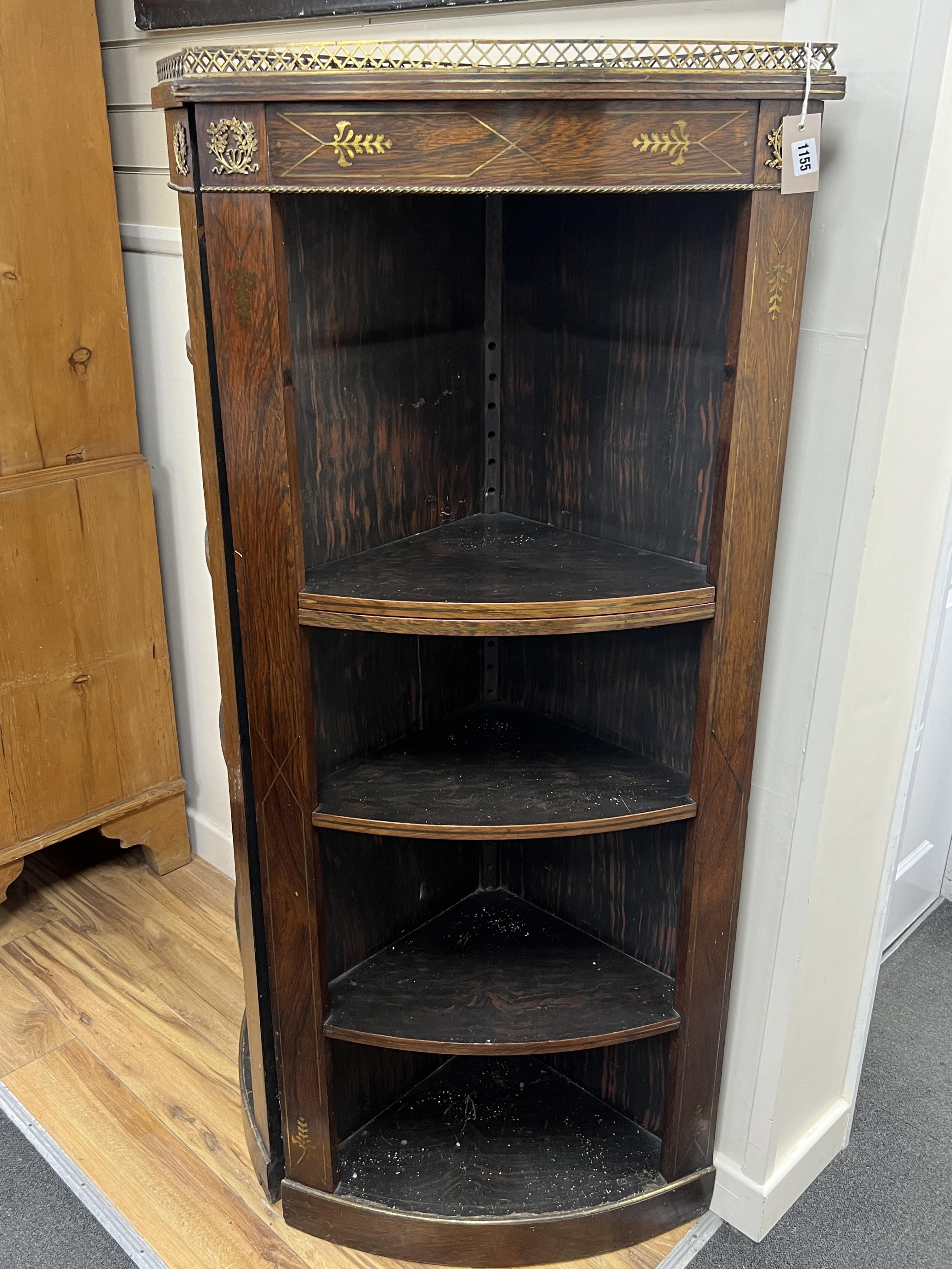 A pair of Regency style brass inlaid rosewood corner cabinets, width 64cm, depth 40cm, height 154cm